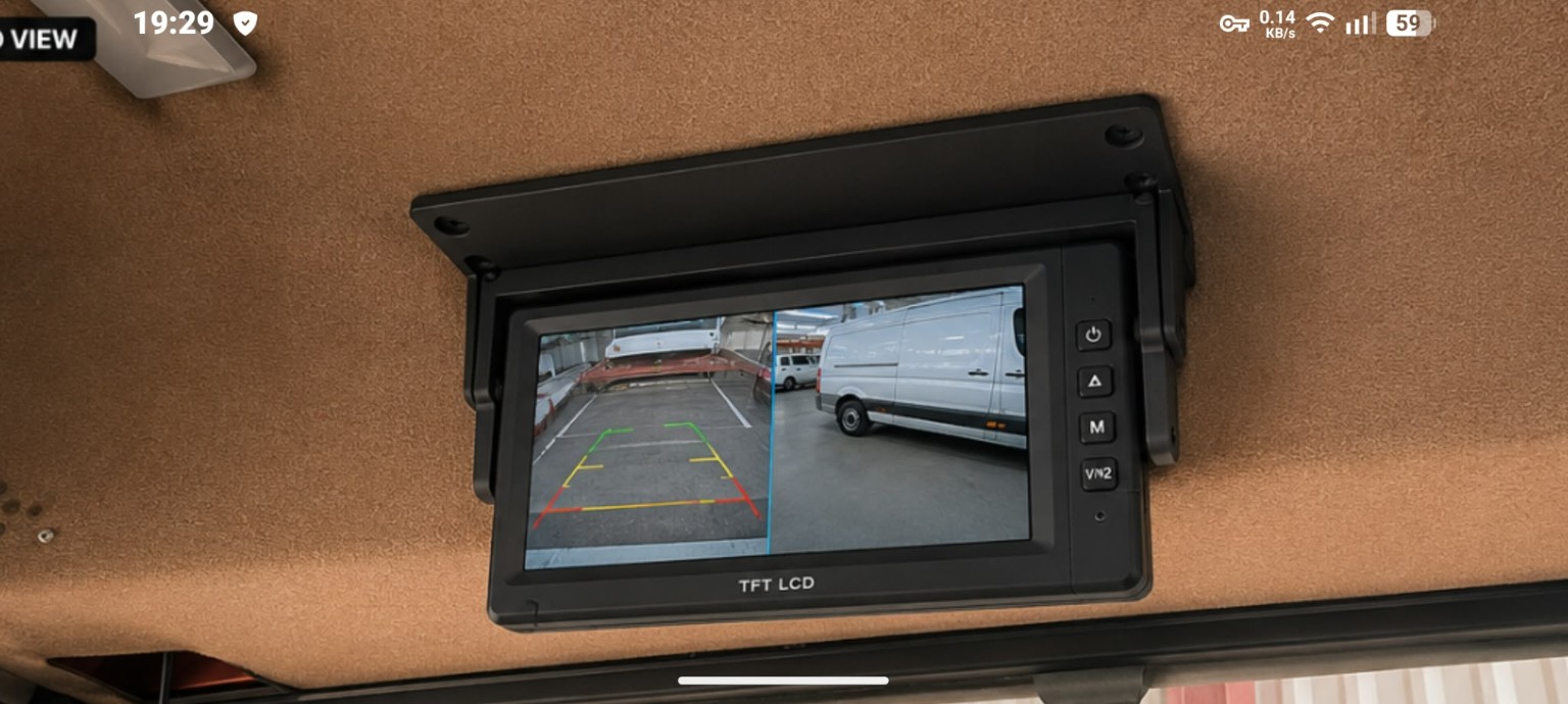A fitted overhead bracket for a reversing-camera monitor.